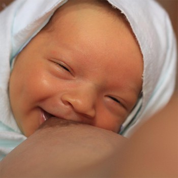 Breastfeeding Baby Laughing